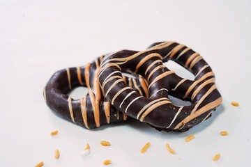 Dark chocolate Pretzels isolated on white