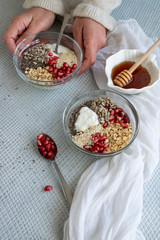 Healthy breakfast mood, muesli with raw pomegranate, sunflower and sesame seeds. Personal point of view