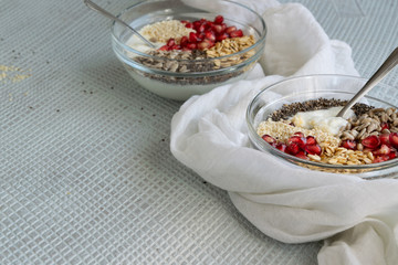Healthy breakfast mood, muesli with raw pomegranate, sunflower and sesame seeds.