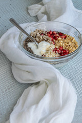 Healthy breakfast mood, muesli with raw pomegranate, sunflower and sesame seeds.