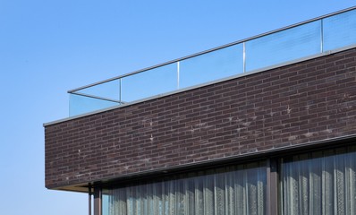 Modern Dutch architecture. Glass panels. Banister. Balcony. Handrail.