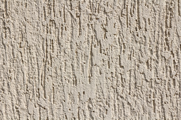 Concrete wall texture background. Natural stones. Building's facade decor. Decorative plaster. House exterior. 