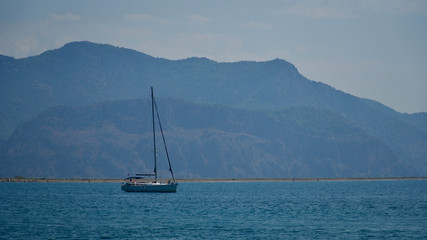 Fototapeta na wymiar sailing yacht anchored in the open sea