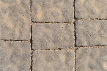 Paving from tiles. Graphic element on a stone. Construction product.	