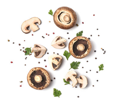 Fresh champignon mushrooms, herbs and spices on white background