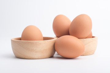 Fresh eggs on a white background.