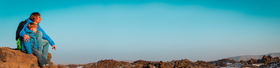 father and son travel hiking in mountains, panorama © nadezhda1906