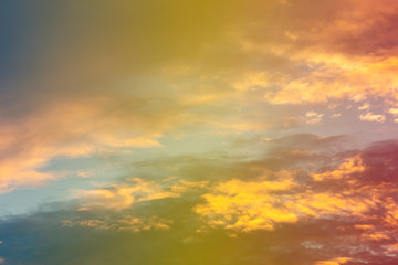 A soft fog cloug background with pastel colored orange to blue gradient