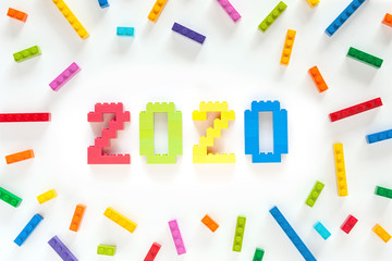 umbers 2020 made from toys blocks with scattered blocks on white background