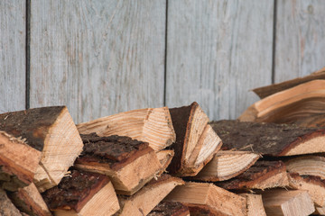  wooden background with chopped firewood