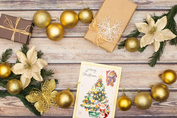 Beautiful gold Christmas decoration on wooden table 