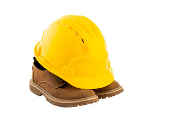 Yellow safety helmet and a pair of shoes on whte background