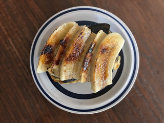 Fresh homemade toast with grilled banana topping - horizontal cutting. Delicious breakfast. 