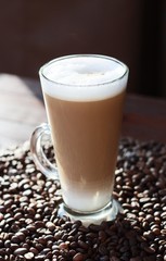 Delicious coffee latte and beans close up 