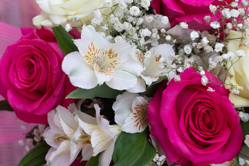 Bouquet with bright flowers . A background of floral roses. Beautiful flowers. A gift for the holiday.
