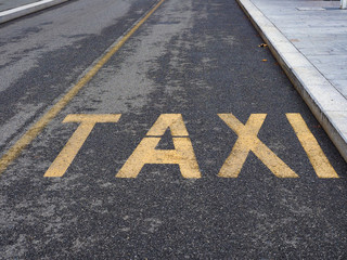 taxi sign on tarmac