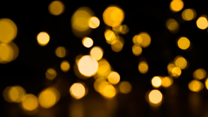 Golden christmas balls, shiny celebration background on christmas tree glow 
