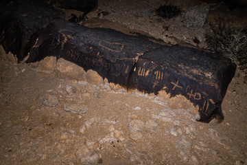 Night view of a drawing carved in stone by a primitive man in the desert in southern Israel near the Avdat fortress