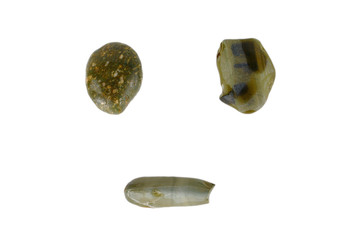 Three green sea stones lie in the shape of a face. isolate