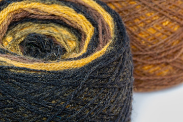 Multicolored skeins of wool yarn. Knitting and crochet. Crafts, hand-made.