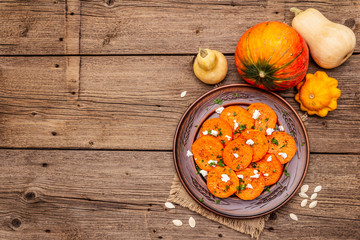 Roasted pumpkin with salted cheese and herbs