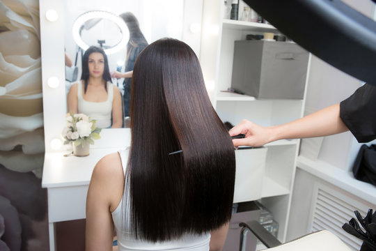 Saturated healthy shiny hair after keratin recovery. The concept of recovery structure.
