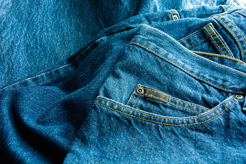 Closeup Of Jeans Texture Background, Lot Of Different Blue Jeans, Texture Of Classic, Space For Text And Ideas Of Fashion.