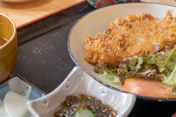 Japanese cuisine, deep-fried pork cutlet as known as Tonkatsu served with Miso soup and salad