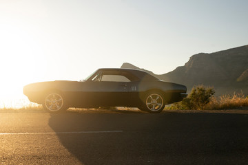 Muscle car 1967 side view sunset