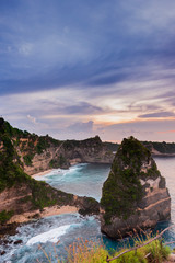 Early morning sunrise with Vew of cliff Nusa Penida Island, Bali, Indonesia. Azure beach, rocky mountains in ocean