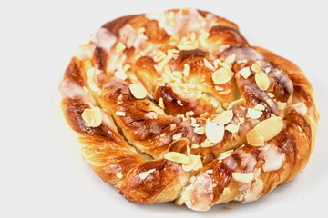 Close up of danish puff pastry with almonds isolated on white background.