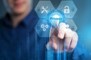 Business, Technology, Internet and network concept. Young businessman working on a virtual screen of the future and sees the inscription:Privacy.