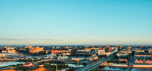 Sunrise top view to center of Yoshkar-Ola city and Kokshaga river embankment. Image with space for...