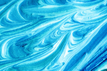 Macro photo. Paint of blue shades close up. Abstract bright image. A thick layer of paints. The concept of drawing, art therapy.