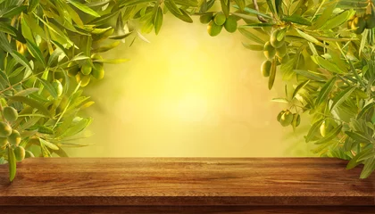 Fotobehang Mockup of empty table with olives branches with fresh olives on yellow background. © Tatyana Sidyukova