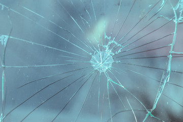 Car accident with shooting concept. Legacy retro car window with signs of shooting a driver.