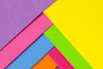 An abstract geometric textured background of multicolored rainbow colors created with overlapping...