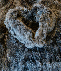 Rabbit fur jacket in heart shape photographed as a background