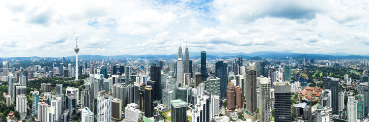 Fototapeta na wymiar View from above, stunning panoramic view of the Kuala Lumpur skyline during a cloudy day. Kuala Lumpur commonly known as KL, is the national capital and largest city in Malaysia.