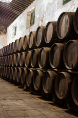 Production of fortified jerez, xeres, sherry wines in old oak barrels in sherry triangle, Jerez la Frontera, El Puerto Santa Maria and Sanlucar Barrameda Andalusia, Spain