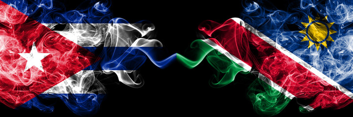 Cuba, Cuban vs Namibia, Namibian smoky mystic flags placed side by side. Thick colored silky travel abstract smokes banners.