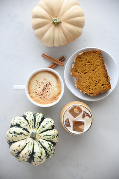 Overhead view of pumpkin bread served with flavored drinks