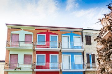 Fototapeta na wymiar Colorful apartmens on the boulevard along the Adriatic Sea. Porto Recanati, Italy