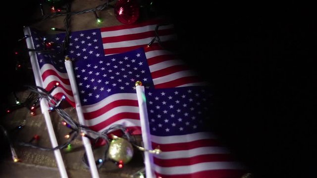 american flas and glowing christmas lights shadow play background