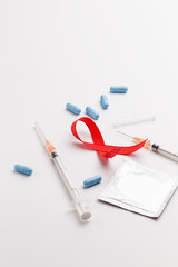 The red ribbon is an international symbol of HIV and AIDS awareness