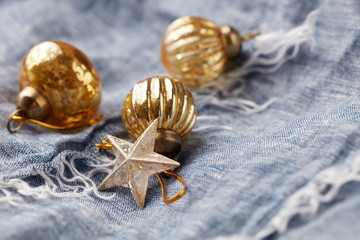 Christmas golden baubles on blue background. Copy space. 