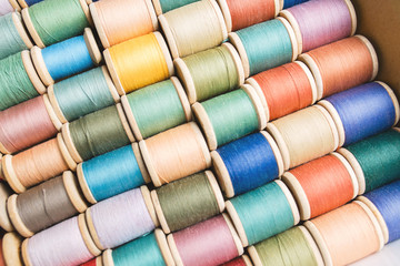 rolls of colorful threads, close-up and top view.