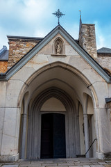 Fototapeta na wymiar Entrance to St. Cornelius Church of the former abbey in Kornelimuenster, District of Aachen, Nort Rhine Westphalia, Germany