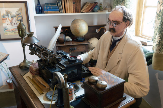 Brighton, United Kingdom - 8 October 2019: Model or wax work of Joseph Rudyard Kipling in his office at the Grange Museum Rottingdean, Brighton UK.