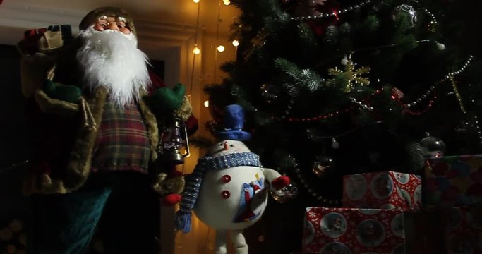 Santa clause standing in specially decorated room, looking at camera and smiling - christmas spirit concept close up portrait 4k footage